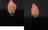 Ceramic head of Harpocrates from the Greek period in Egypt -