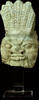 Head of the god Bes. Turquoise blue glazed earthenware. -