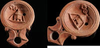 Roman oil lamp A Roman terracotta oil lamp with a cista/altar -