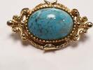 Brosche Nadel mit blauem Stein vergoldet L: ca. 3,0 cm -